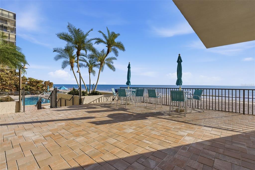 15462 Gulf Boulevard, Unit 406 Madeira Beach, FL 33708 - Photo 37 of 48 a view of a swimming pool with a chair
