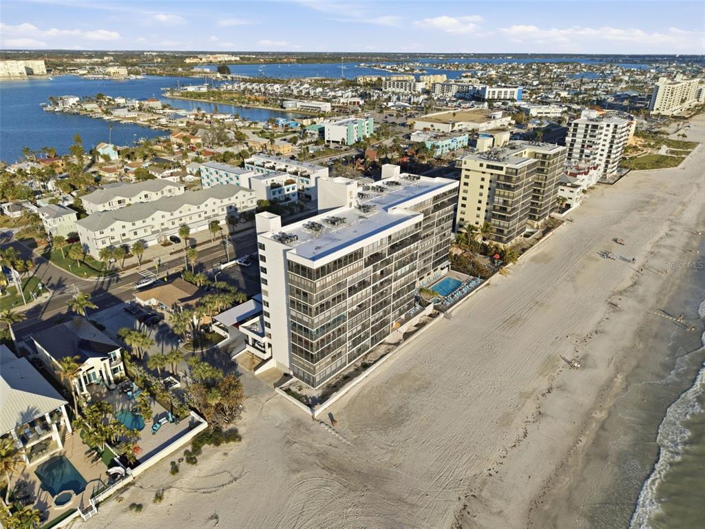 15462 Gulf Boulevard, Unit 406 Madeira Beach, FL 33708 - Photo 43 of 48 an aerial view of residential building and ocean view