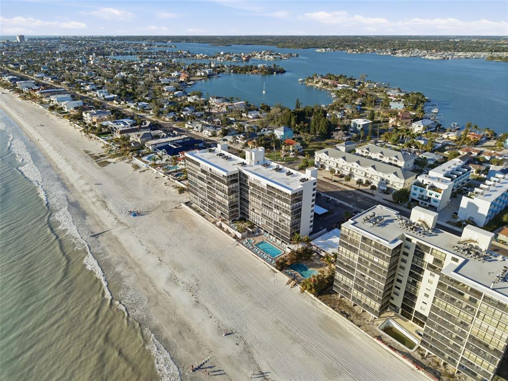 15462 Gulf Boulevard, Unit 406 Madeira Beach, FL 33708 - Photo 45 of 48 an aerial view of lake and residential houses with outdoor space
