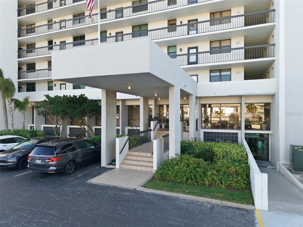 15462 Gulf Boulevard, Unit 406 Madeira Beach, FL 33708 - Photo 5 of 48 a view of a car park in front of a building