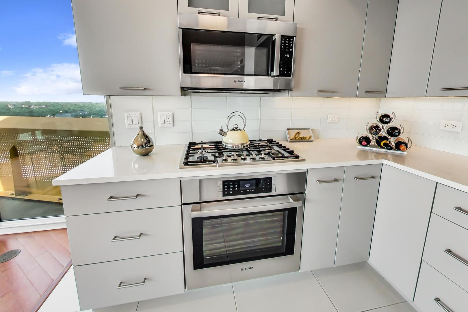 1720 Maple Avenue, Unit 2740 Evanston, IL 60201 - Photo 12 of 63 a kitchen with a stove and a microwave