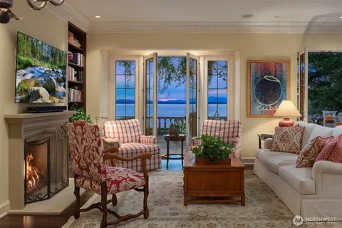 a living room with furniture a fireplace and decor