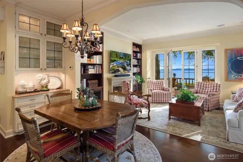 a view of a dining room with furniture and chandelier