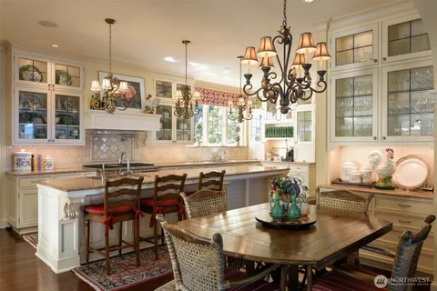a kitchen with a table and chairs in it