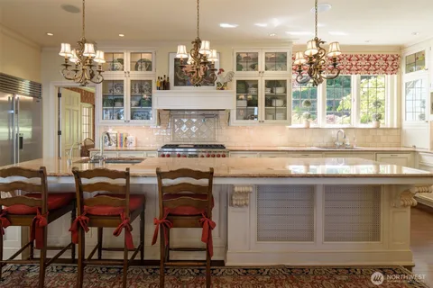 a kitchen with cabinets and window