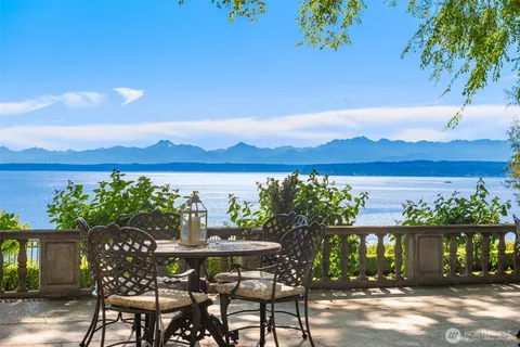a view of a chairs and table in patio