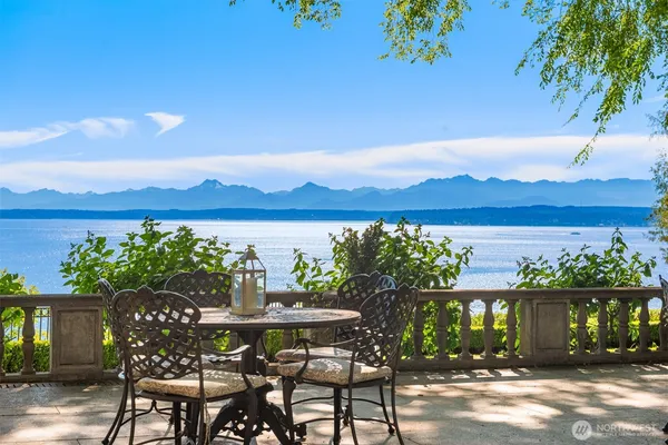 a view of a chairs and table in patio