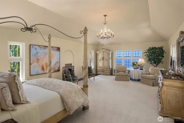 a view of a hallway with wooden floor and a livingroom