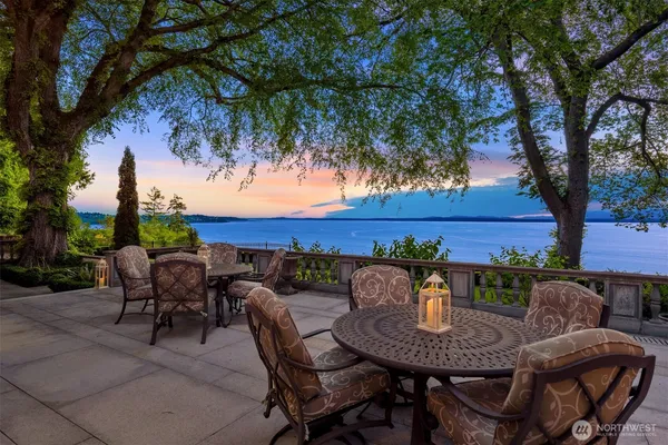 a view of a chairs and table in patio