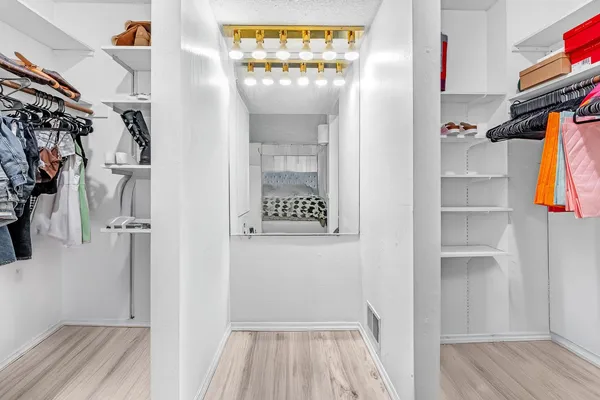 a bathroom with a sink a toilet and shower curtain