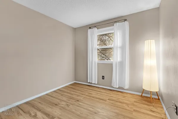 a bedroom with furniture and a book shelf