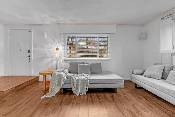 a bedroom with a bed and a couch