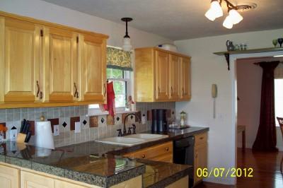 701 3rd Avenue West Springfield, TN 37172 - Photo 5 of 20 THE KITCHEN FEATURES GRANITE COUNTERTOPS AND TILE BACKSPLASH!