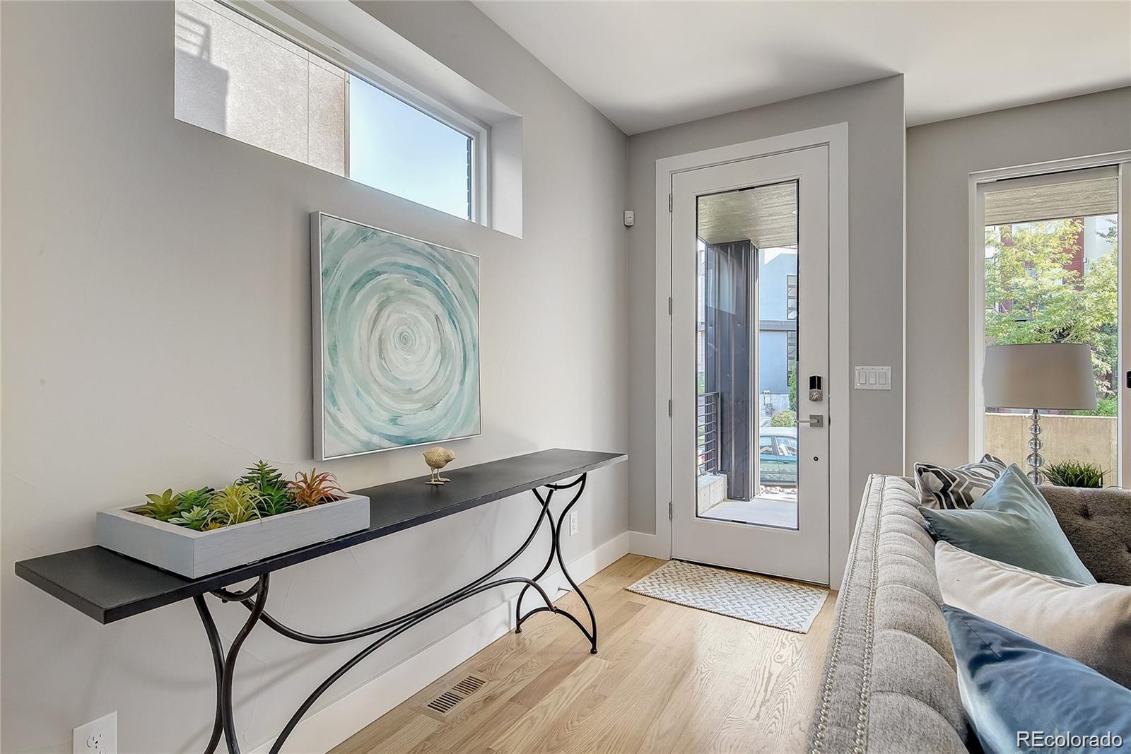 1811 West 32nd Avenue, Unit R Denver, CO 80211 - Photo 12 of 40 a living room with furniture and a window