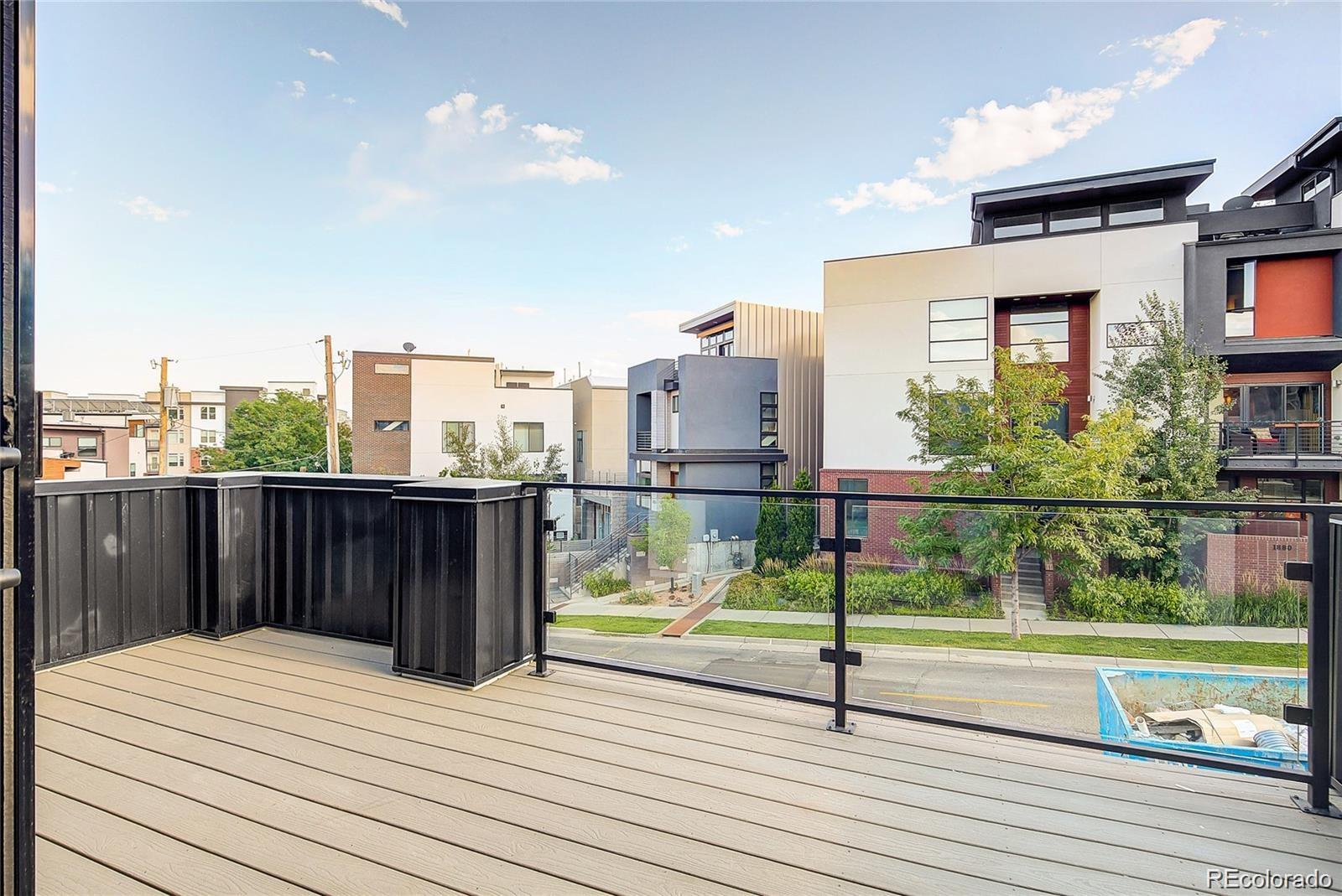 1811 West 32nd Avenue, Unit R Denver, CO 80211 - Photo 26 of 40 a view of a terrace with wooden walls