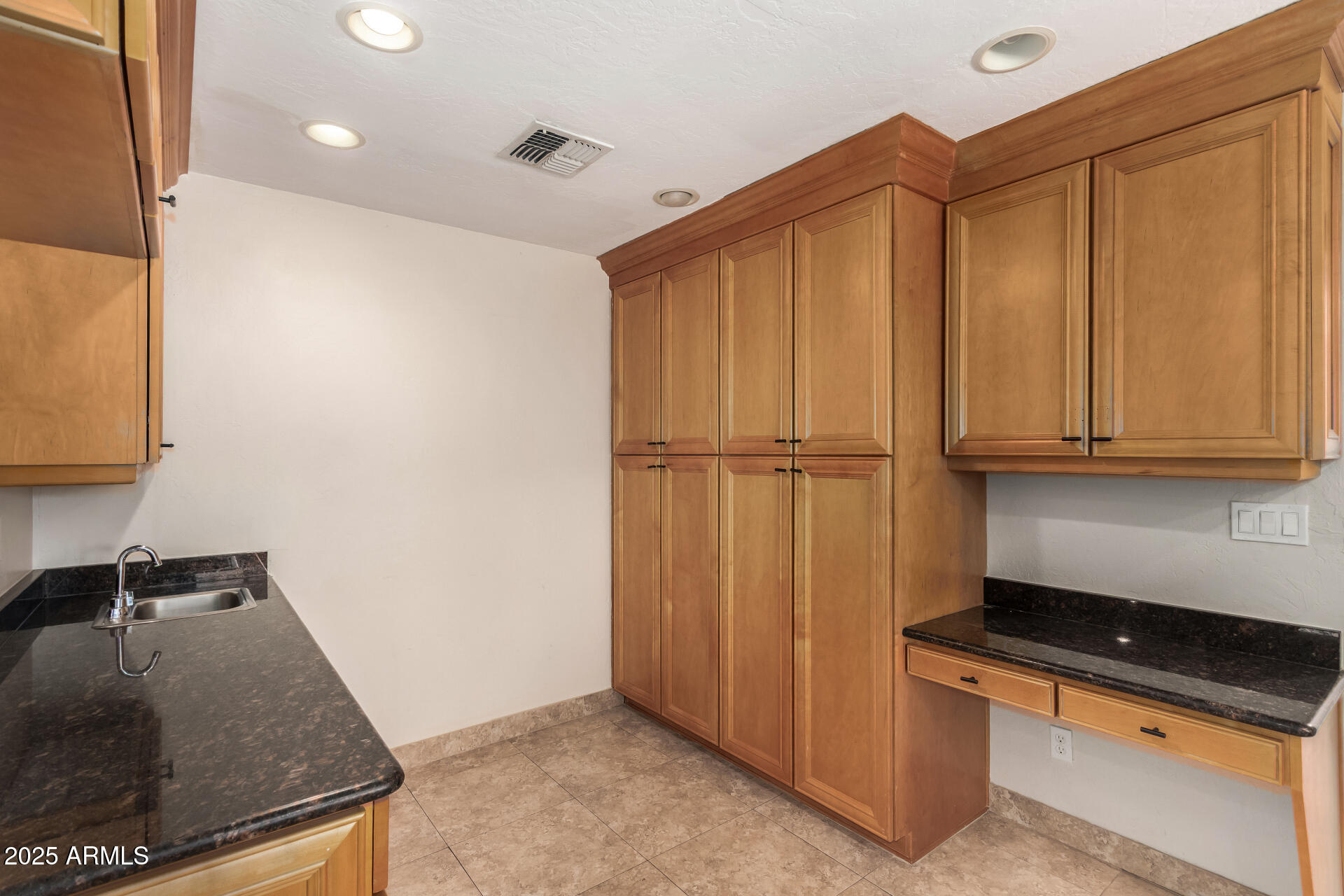 5739 East Cactus Road Scottsdale, AZ 85254 - Photo 13 of 52 a kitchen with stainless steel appliances granite countertop a refrigerator and a sink