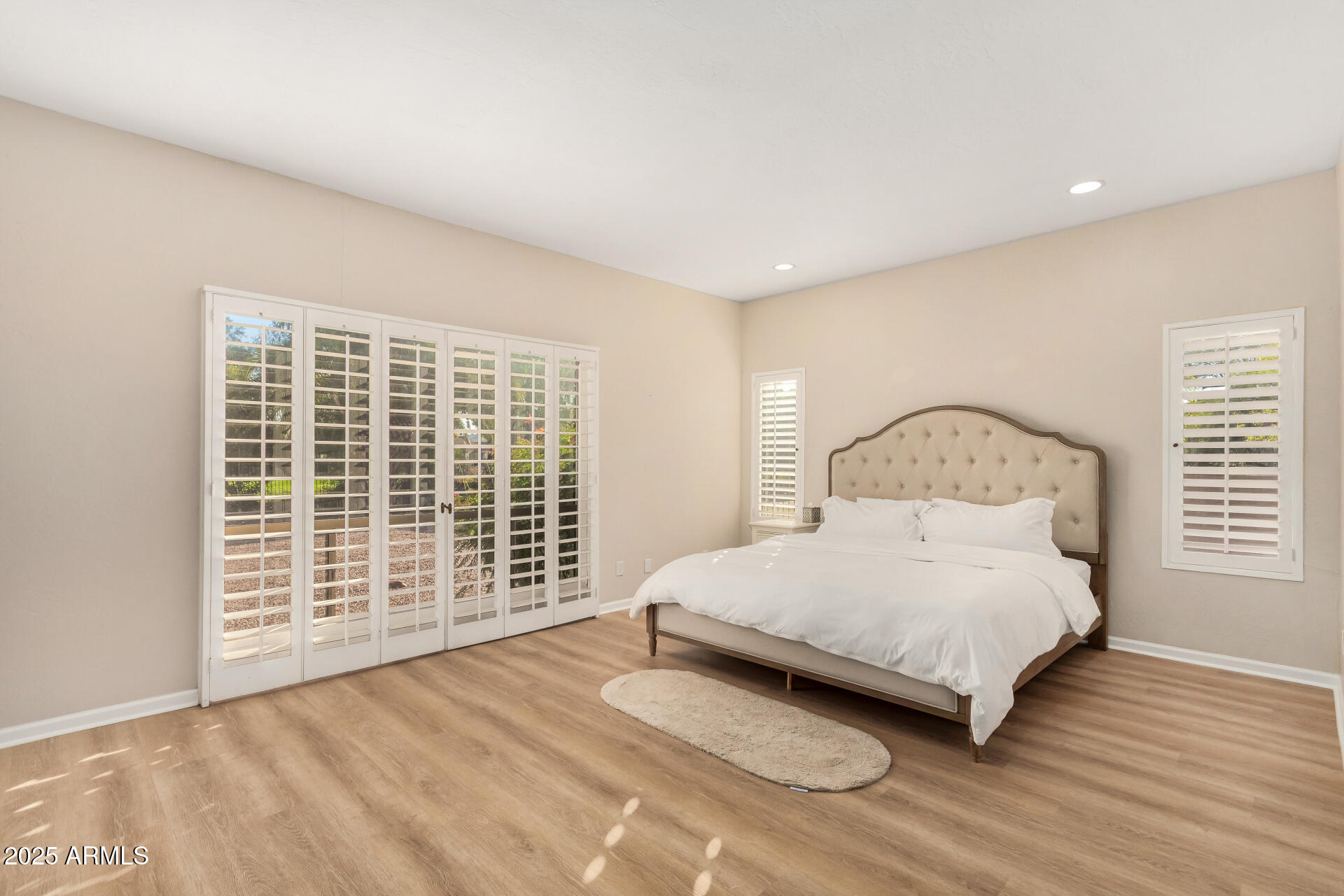 5739 East Cactus Road Scottsdale, AZ 85254 - Photo 16 of 52 a bedroom with a bed and a window