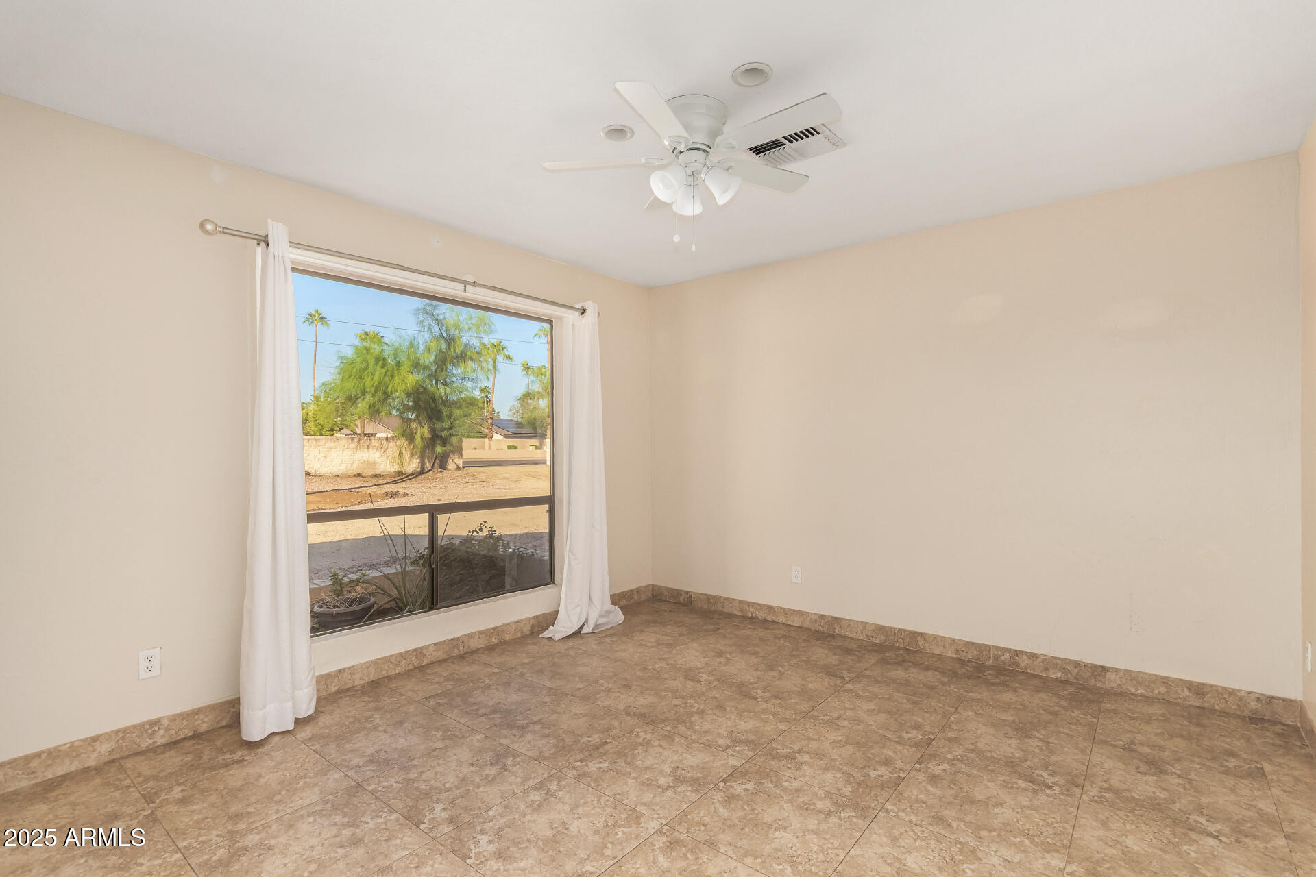 5739 East Cactus Road Scottsdale, AZ 85254 - Photo 21 of 52 an empty room with windows and entrance