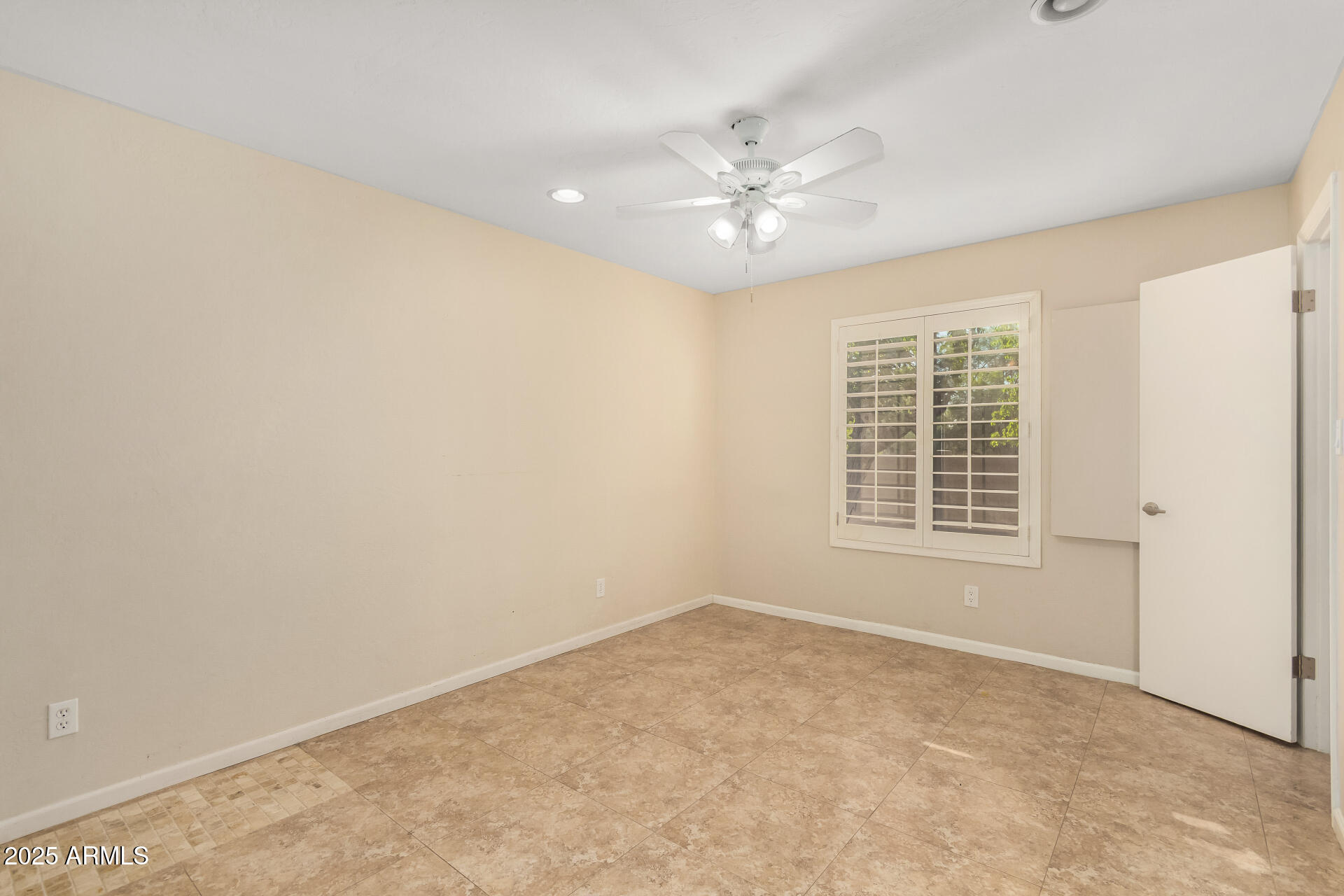 5739 East Cactus Road Scottsdale, AZ 85254 - Photo 27 of 52 a view of an empty room with a window