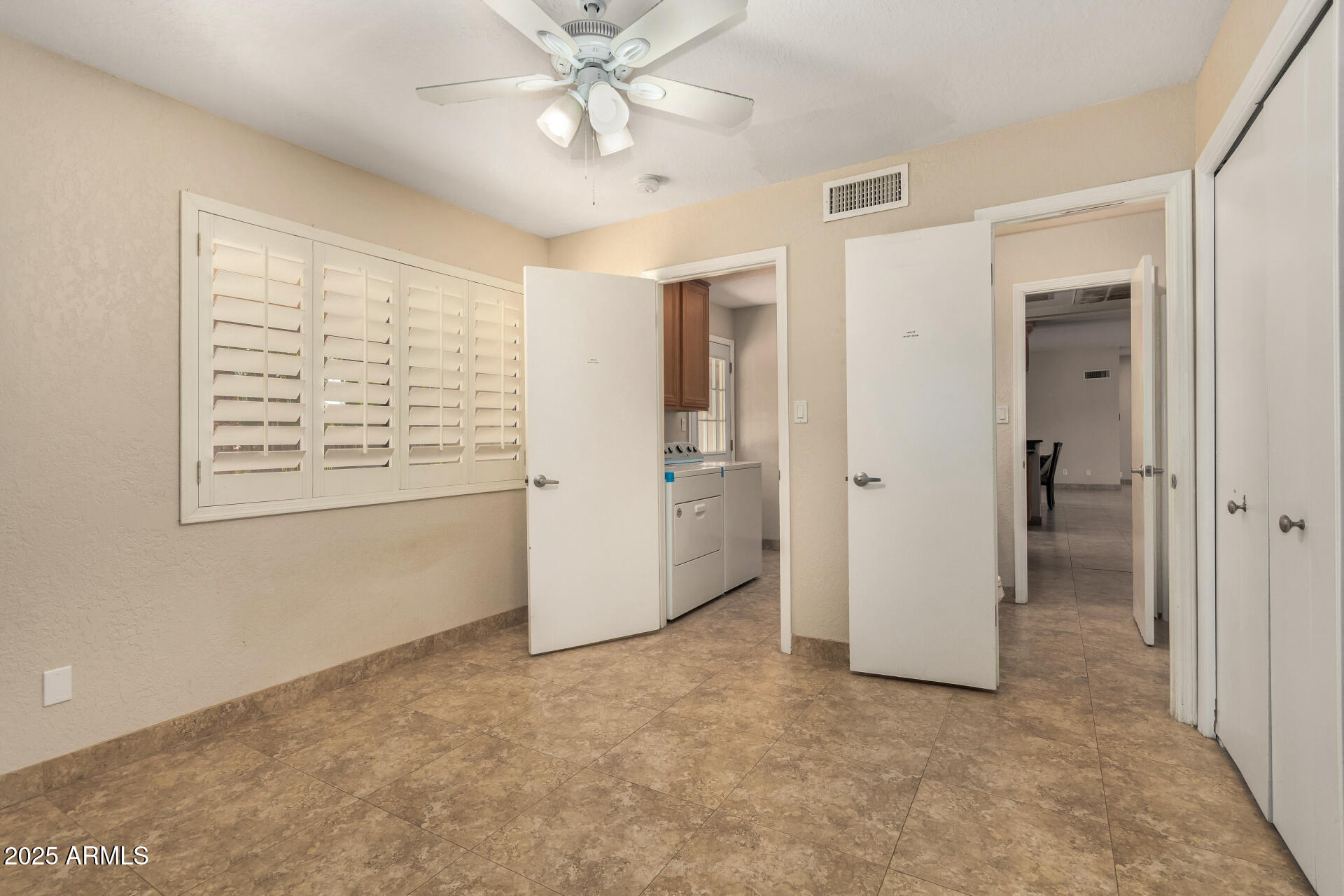 5739 East Cactus Road Scottsdale, AZ 85254 - Photo 35 of 52 a view of an empty room with a window