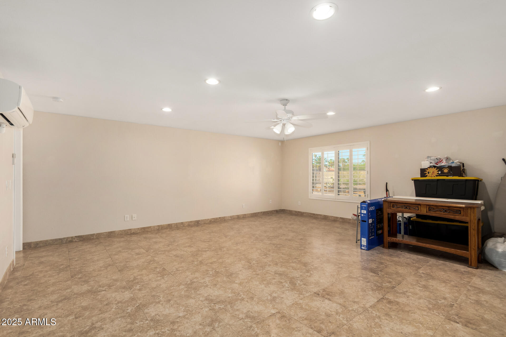 5739 East Cactus Road Scottsdale, AZ 85254 - Photo 37 of 52 an empty room with a window