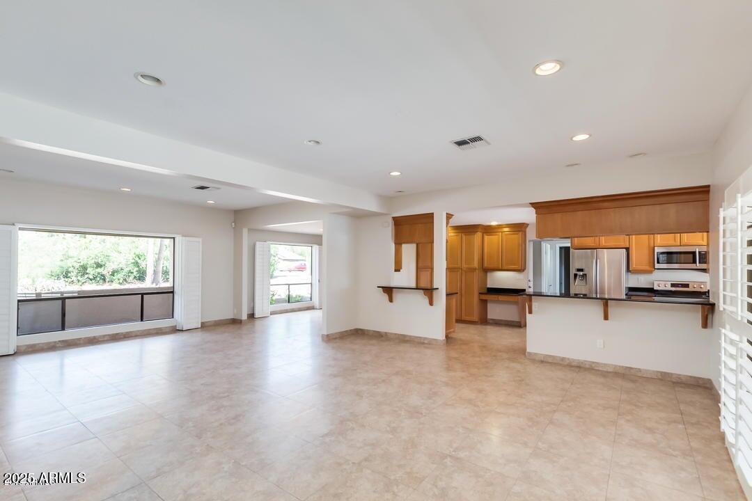5739 East Cactus Road Scottsdale, AZ 85254 - Photo 49 of 52 a view of a livingroom with furniture and window