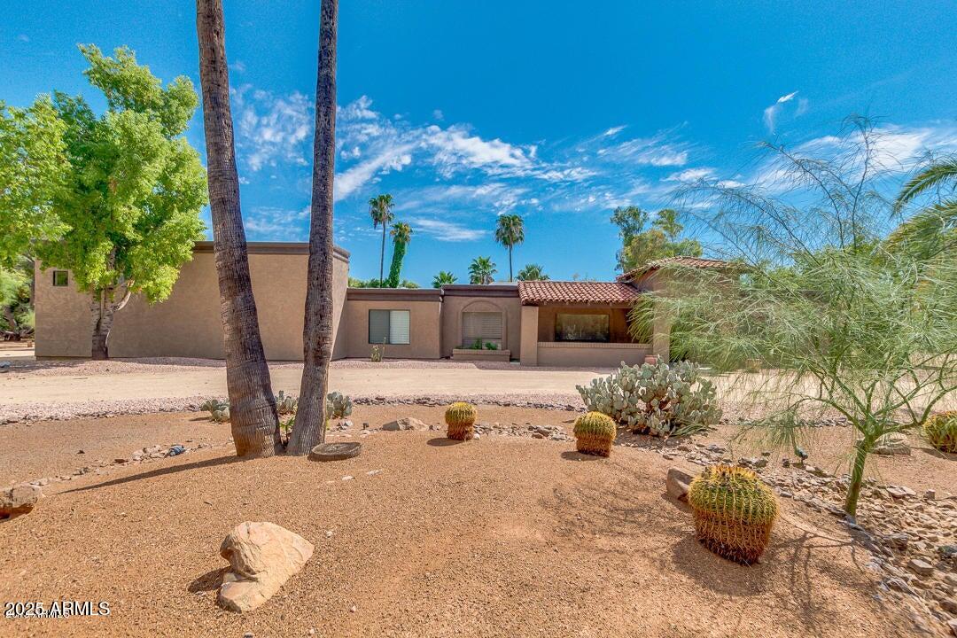 5739 East Cactus Road Scottsdale, AZ 85254 - Photo 52 of 52 a view of a house with backyard and sitting area