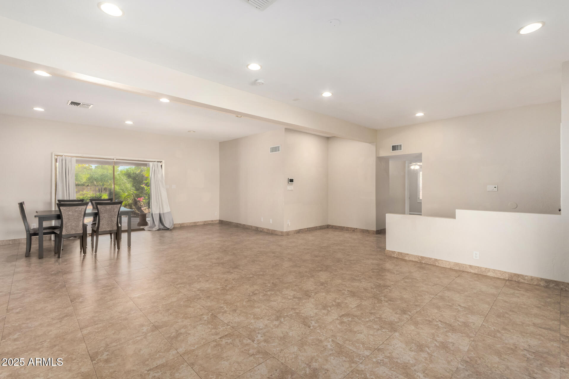 5739 East Cactus Road Scottsdale, AZ 85254 - Photo 7 of 52 a view of dining room with furniture and floor to ceiling window