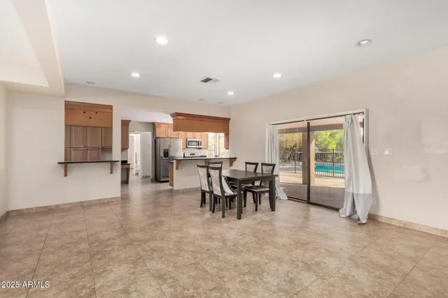 a view of a dining room with furniture window and outside view