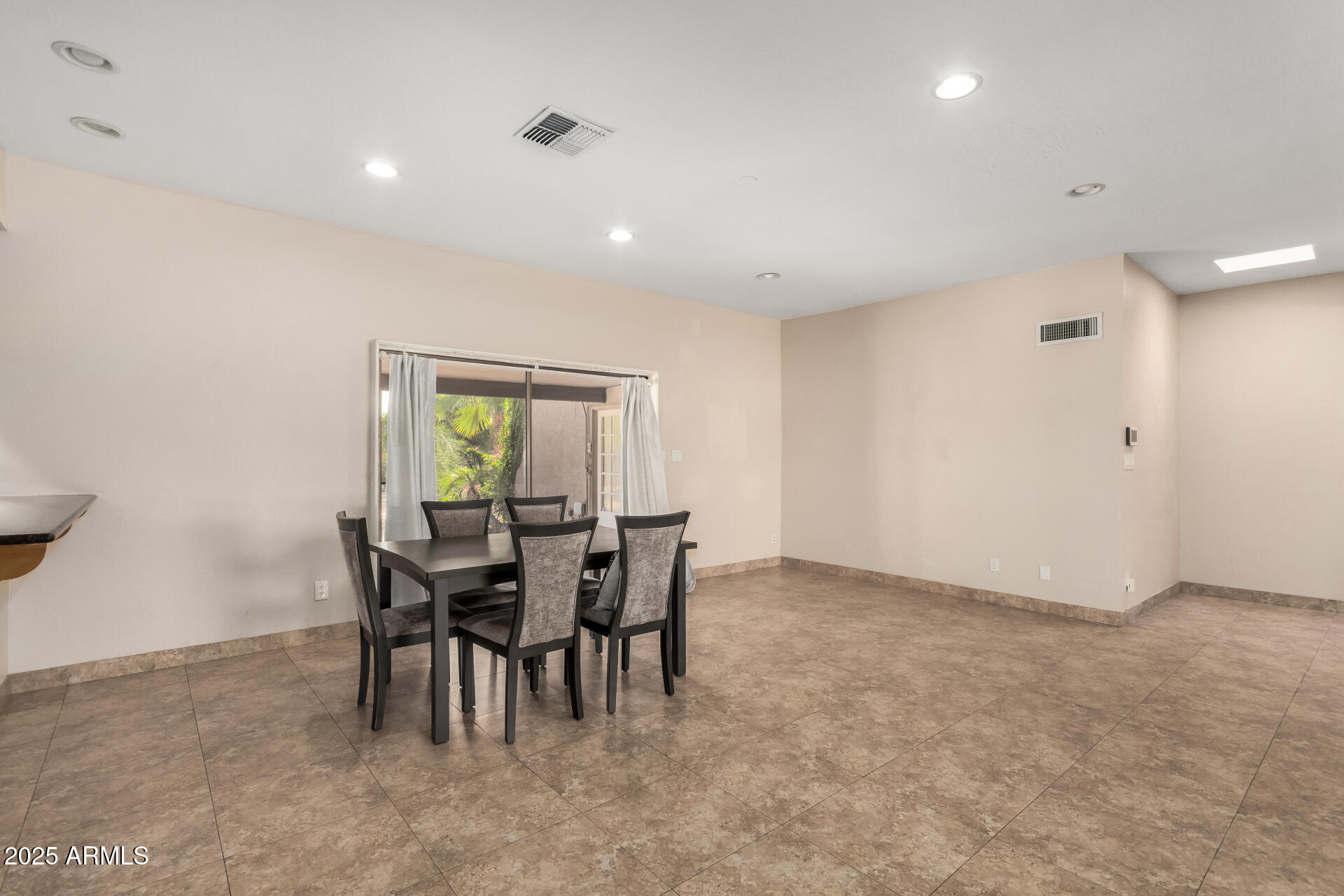5739 East Cactus Road Scottsdale, AZ 85254 - Photo 10 of 52 a view of a dining room with furniture