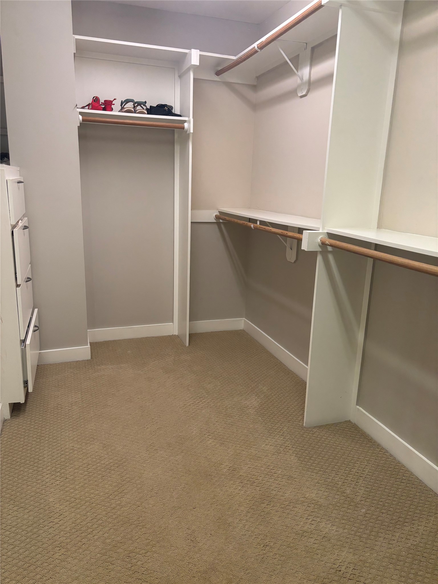 6016 Truro Street Houston, TX 77007 - Photo 19 of 26 Custom-designed walk-in closet with abundant hanging space and built-in organization.