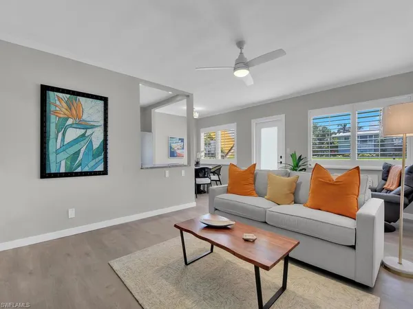 a living room with furniture and a large window