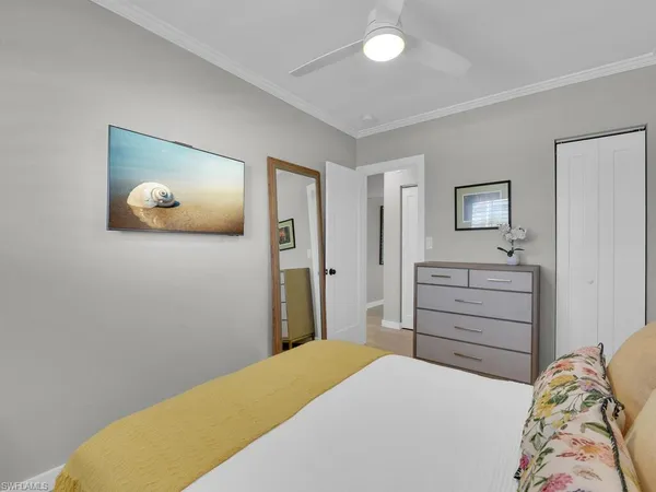 a bedroom with a bed and a dresser
