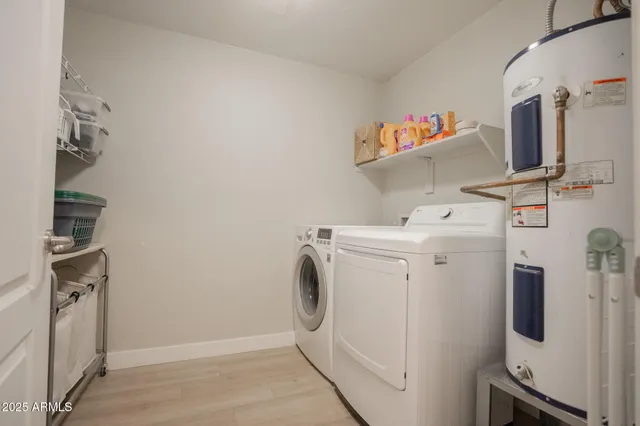 a bedroom with a bed and a night stand