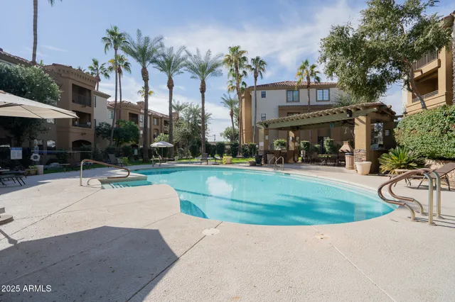 a view of a fountain with a fountain in front of house