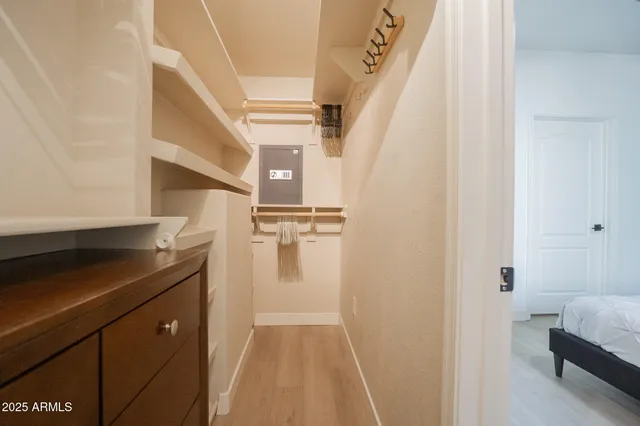 a view of a hallway with wooden floor