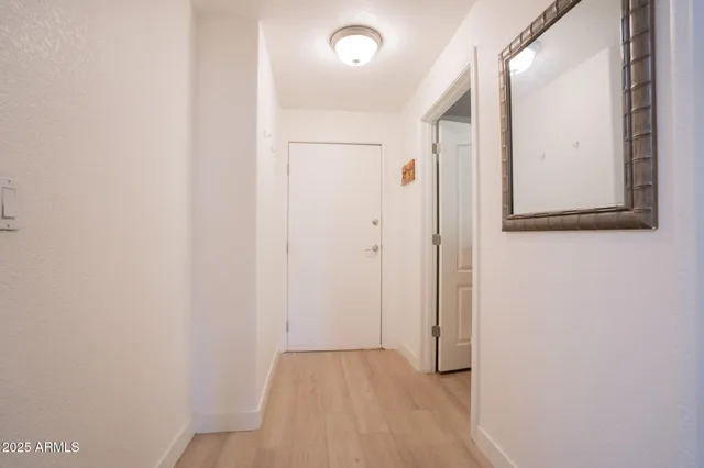 a room with furniture pool table and windows