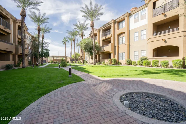 a view of a street with a building in the background