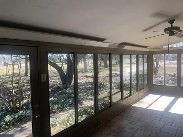a view of hallway with windows