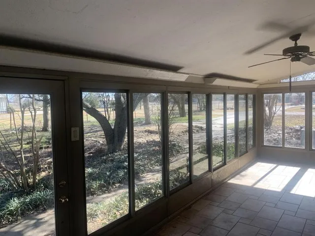 a view of hallway with windows