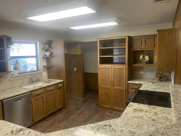 a kitchen with a sink and a refrigerator