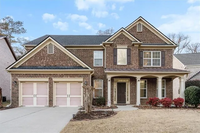 front view of a house with a yard