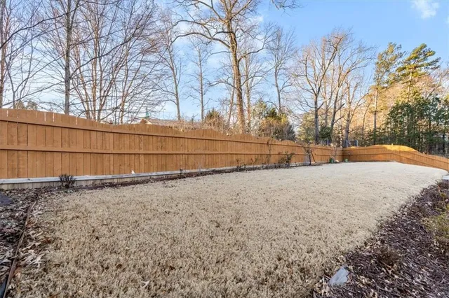 a view of backyard space with trees