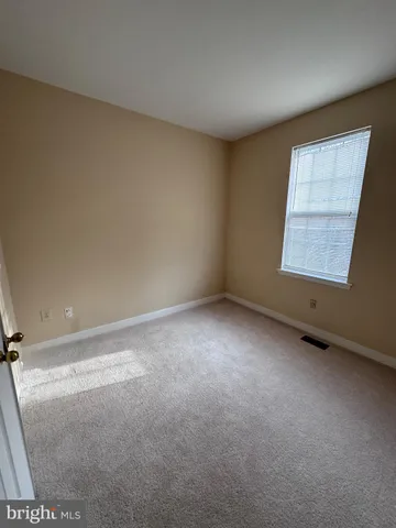a view of a closet in an empty room