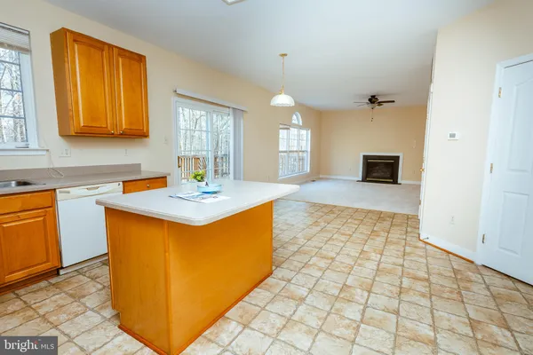 a kitchen with stainless steel appliances granite countertop a sink and a granite counter tops