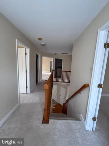 a bathroom with a double vanity sink mirror and bathtub