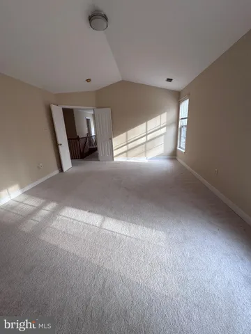 a white toilet sitting next to a shower