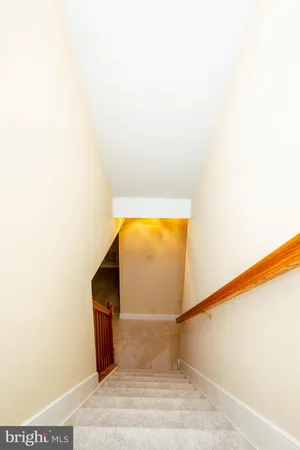 a view of an empty room with stairs