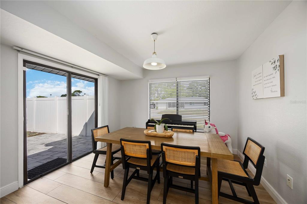6775 Dennison Avenue North Port, FL 34287 - Photo 14 of 50 a dining room with furniture and window
