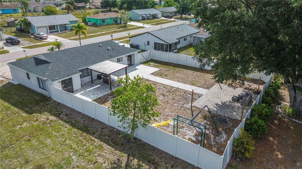 6775 Dennison Avenue North Port, FL 34287 - Photo 2 of 50 an aerial view of a house with a yard